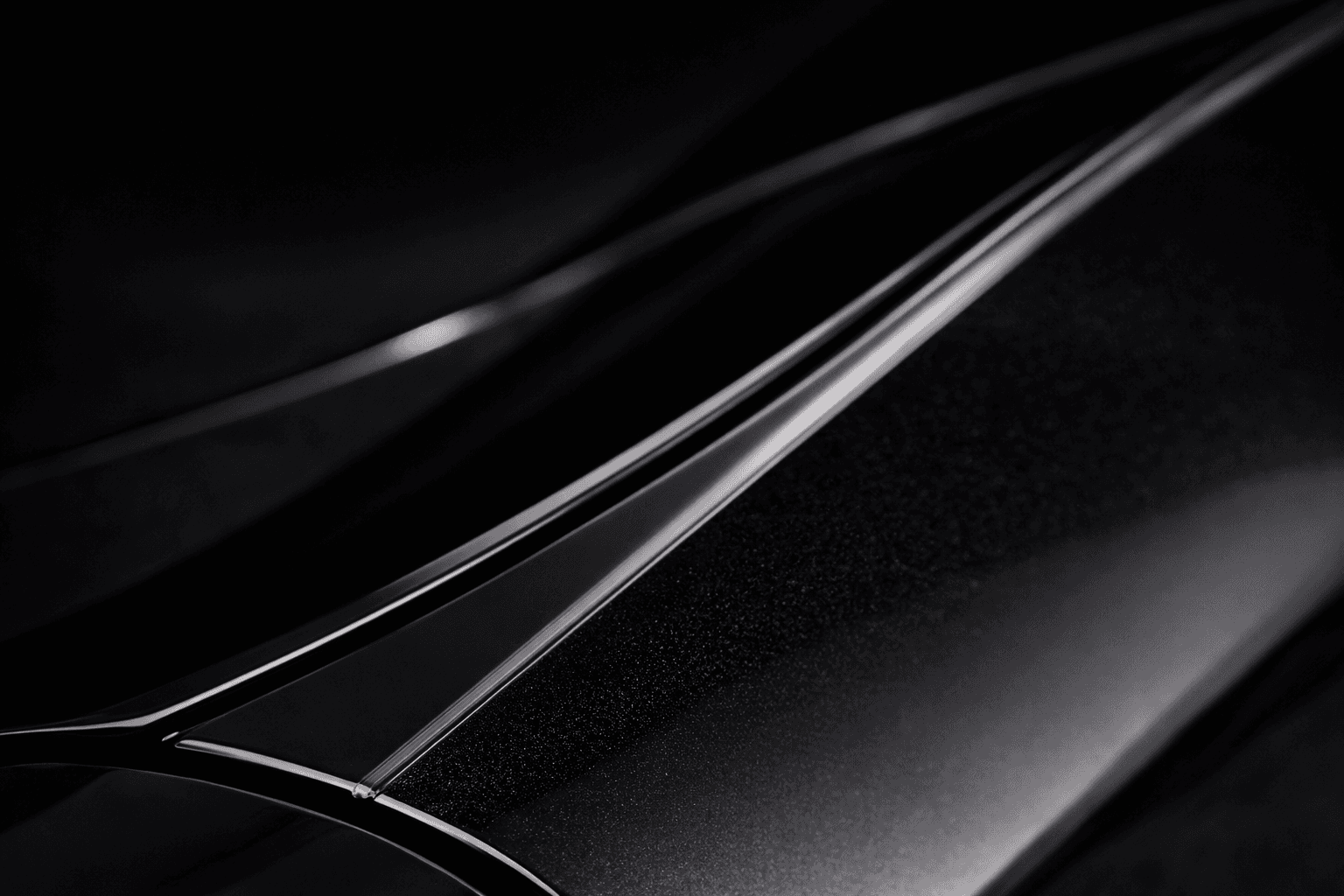 Macro detail of paint protection film aligned cleanly along a vehicle panel edge